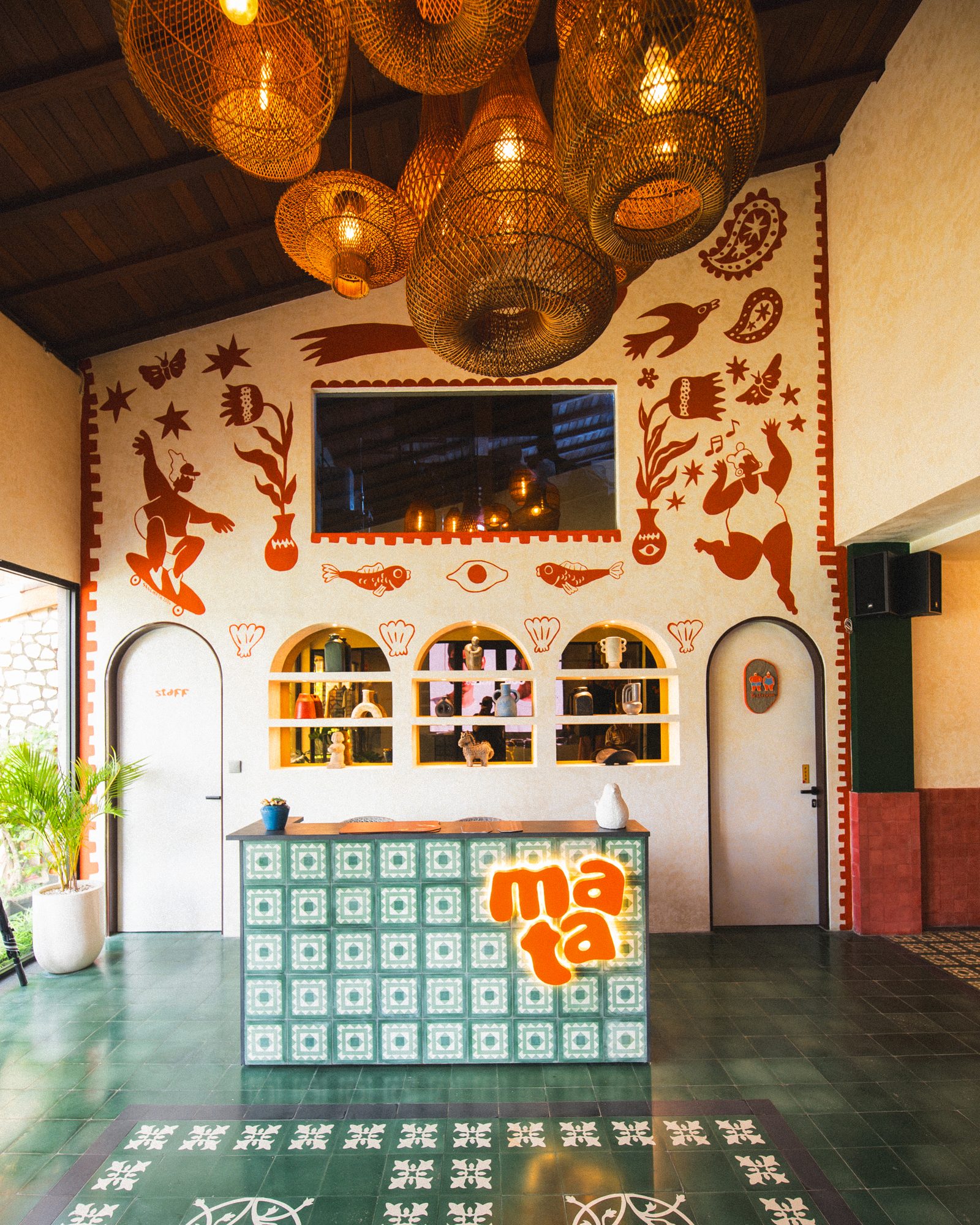 The green-tiled interior of Mata Berawa, a hangout spot in Berawa, Canggu